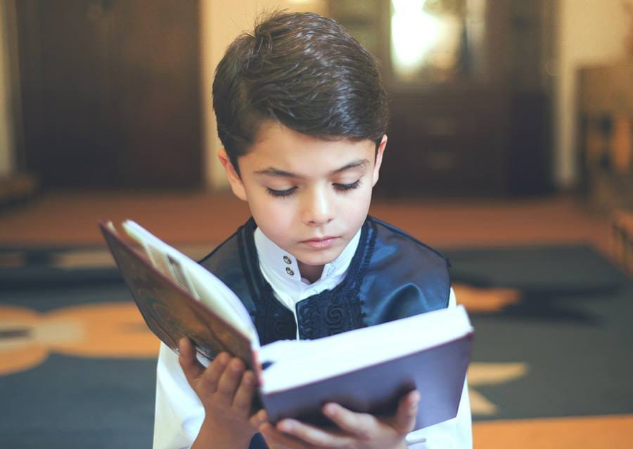 A child reading the Quran